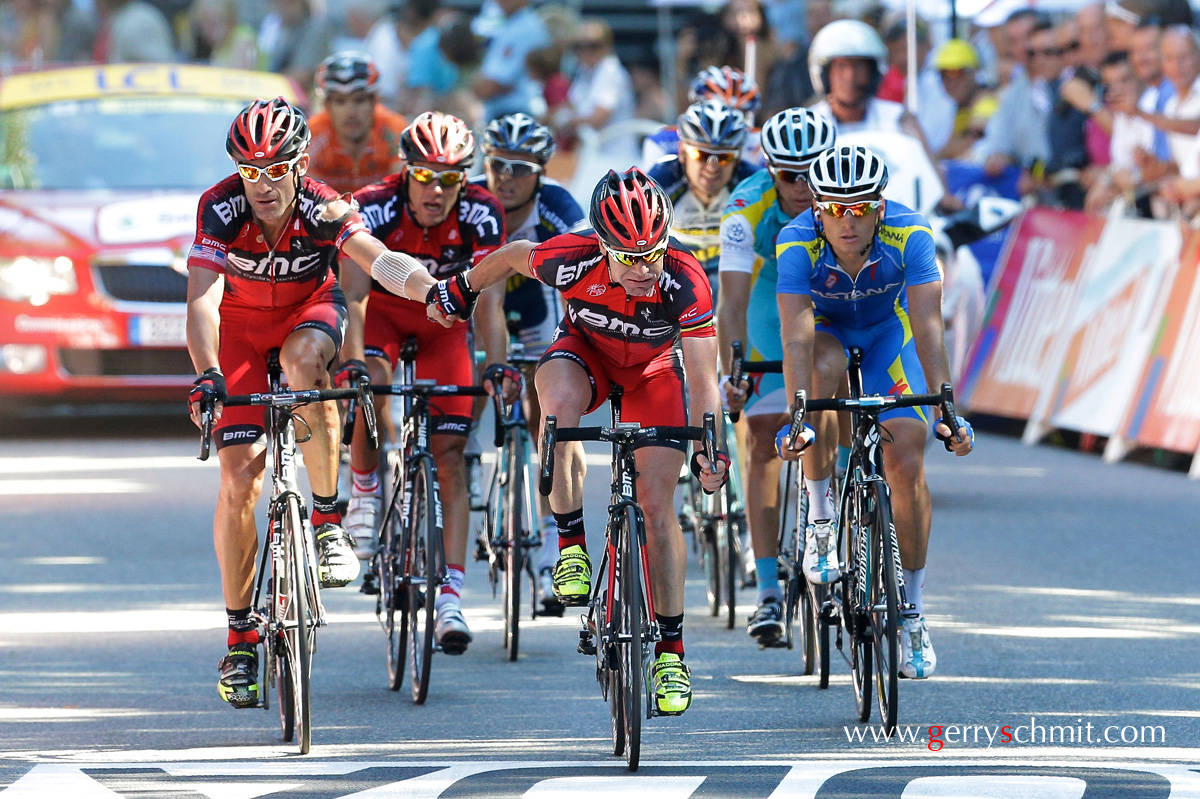 Former Tour de France Winner Cadel EVANS loosing precious time at stage 16 and holding hands of his teammate George HINCAPIE