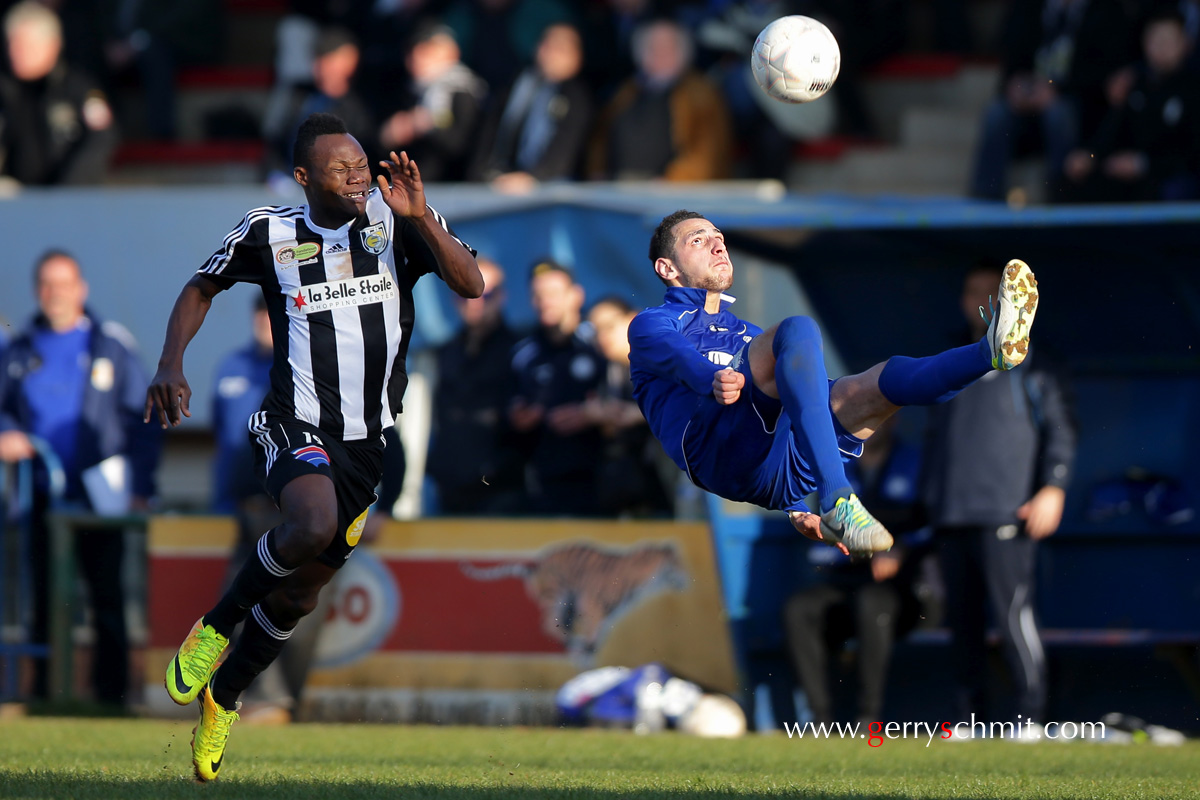 Samir SIDI MAMMAR floats in the air as he goes for an overhead kick