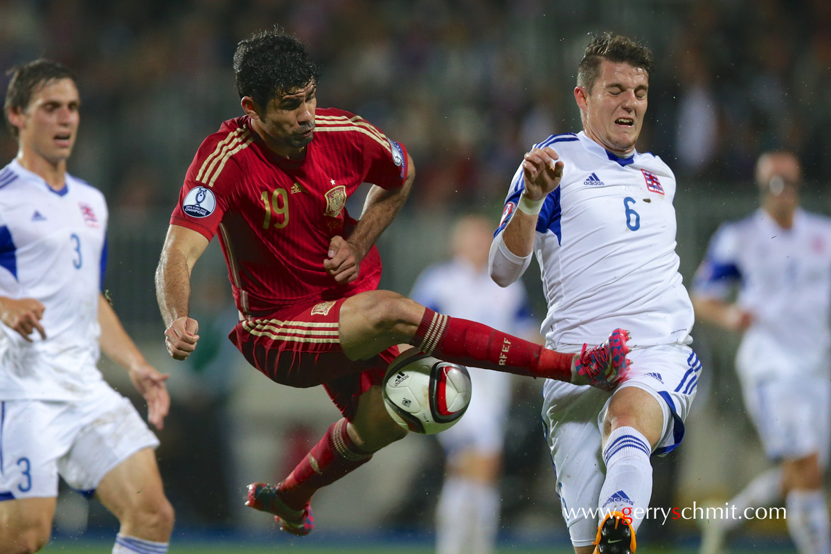 Duel between Diego Costa (Spain) and Chris Philipps (Luxembourg) during EM Qualifying game