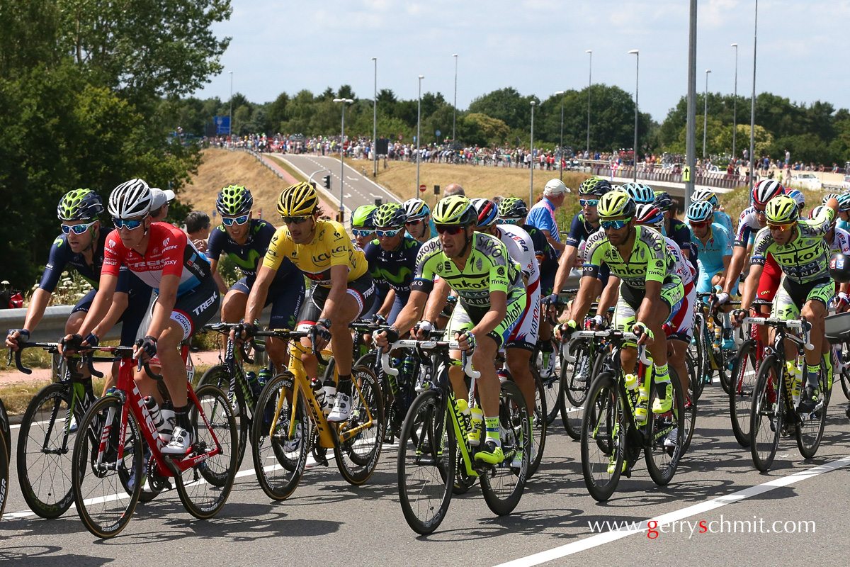 Bob Jungels of Luxembourg rides in front of Fabian Cancellara (TREK Factory Racing) who wears the maillot jaune on stage 3