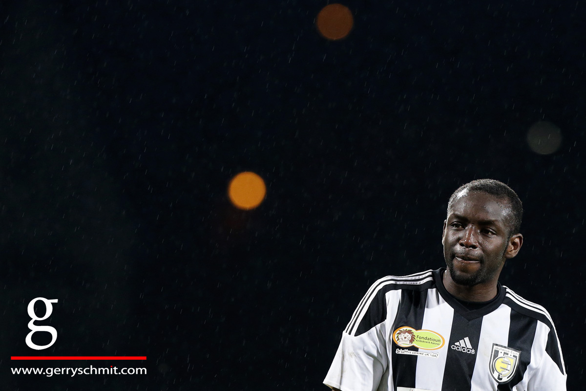 Portrait of Momar Ndiaye in the rain