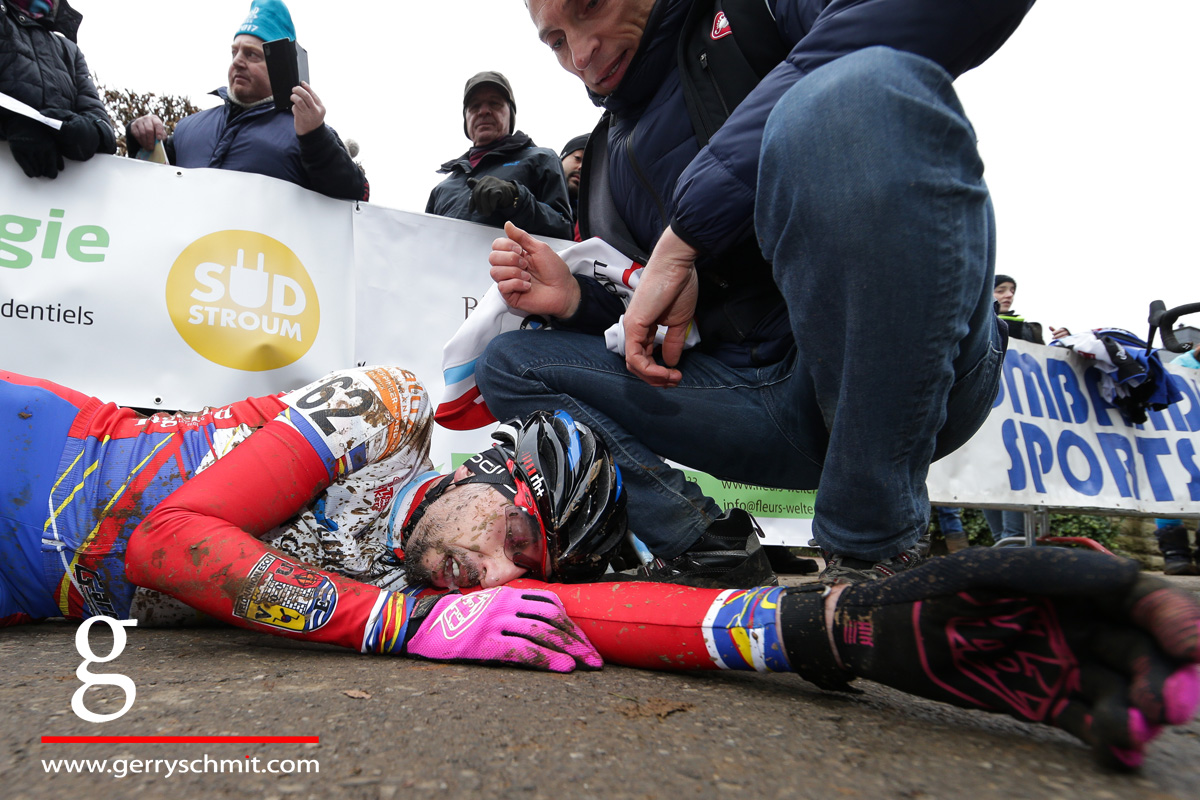 Jerome Junker lies on the ground after winning the Masters title in Cyclocross 2018