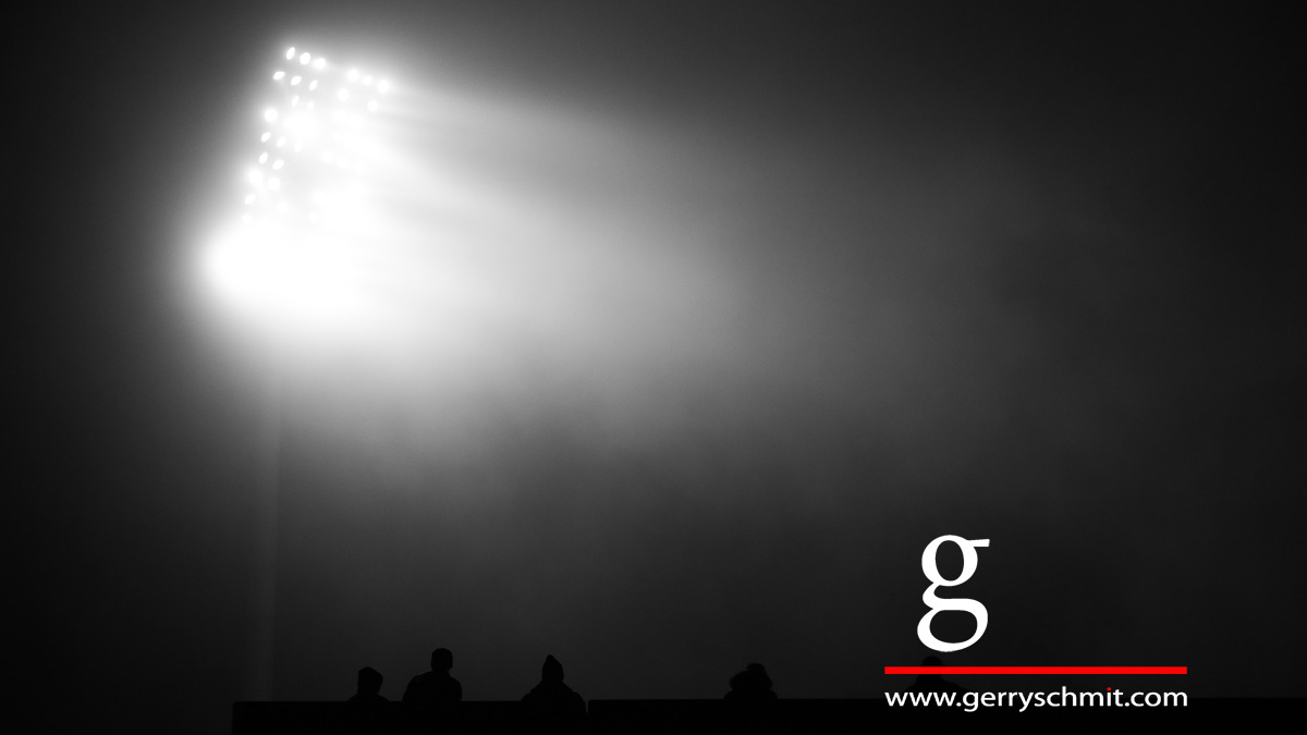 Spektators watch the floodlight game Luxembourg - Belarus in the fog